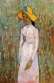 Jeune fille debout sur un fond de blé Vincent van Gogh